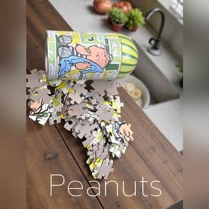 Peanuts 100 piece jigsaw puzzle in collector tin